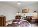 Cozy living room with tufted leather chairs, hardwood floors, and natural light at 820 Bellegray Rd, Clover, SC 29710