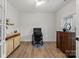 Bright office with hardwood floors, modern desk, and storage cabinet at 820 Bellegray Rd, Clover, SC 29710