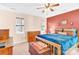 Bedroom with two windows for great natural light, ceiling fan, and a classic wooden chest at 8210 Mattingridge Dr, Charlotte, NC 28270