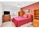 Cozy bedroom featuring soft lighting, a large window, and classic wooden furniture at 8210 Mattingridge Dr, Charlotte, NC 28270