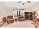 Cozy living room with large windows, comfortable seating, and built-in shelving at 8210 Mattingridge Dr, Charlotte, NC 28270