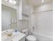 Bright bathroom featuring a shower-tub combination and modern fixtures at 8759 Coralbell Ln, Charlotte, NC 28213