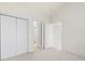 Spacious bedroom showcasing closet space and ample natural light at 8759 Coralbell Ln, Charlotte, NC 28213