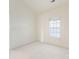 Neutral bedroom featuring a window with blinds and plush carpet at 8759 Coralbell Ln, Charlotte, NC 28213