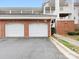 Garage area with brick accents and ample parking space at 8759 Coralbell Ln, Charlotte, NC 28213