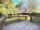 Fenced backyard is seen from the wooden deck area at 9146 Austin Ridge Ln, Charlotte, NC 28214