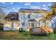 Backyard view of home featuring a deck, siding, windows, and foliage in a landscaped space at 9146 Austin Ridge Ln, Charlotte, NC 28214