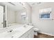 Bright bathroom features a double sink vanity and large mirror at 9146 Austin Ridge Ln, Charlotte, NC 28214