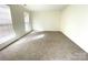 Bright, neutral bedroom featuring carpeting and natural light from two windows with blinds at 9146 Austin Ridge Ln, Charlotte, NC 28214