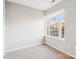 Carpeted bedroom features white walls, natural light, and bright window at 9146 Austin Ridge Ln, Charlotte, NC 28214