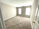 Spacious carpeted bedroom with natural light from two windows at 9146 Austin Ridge Ln, Charlotte, NC 28214