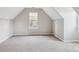 Neutral bonus room with carpet and a bright window for natural light at 9146 Austin Ridge Ln, Charlotte, NC 28214