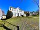 Traditional-style home with a well-manicured lawn, offering great curb appeal and a welcoming atmosphere at 9146 Austin Ridge Ln, Charlotte, NC 28214