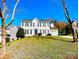 Charming two-story home featuring black shutters, a well-manicured lawn, and an attached two-car garage at 9146 Austin Ridge Ln, Charlotte, NC 28214