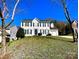 Charming two-story home featuring a classic white exterior with black shutters and attached garage at 9146 Austin Ridge Ln, Charlotte, NC 28214