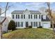 Traditional two-story home with black shutters, attached garage, and a well-maintained front lawn at 9146 Austin Ridge Ln, Charlotte, NC 28214