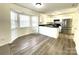 Bright kitchen features stainless steel refrigerator, black appliances, and white cabinets at 9146 Austin Ridge Ln, Charlotte, NC 28214