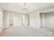 Spacious main bedroom with walk in closet, neutral carpet, and ensuite bathroom at 9146 Austin Ridge Ln, Charlotte, NC 28214