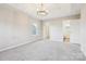 Spacious main bedroom featuring a tray ceiling, neutral carpet, and a chandelier at 9146 Austin Ridge Ln, Charlotte, NC 28214