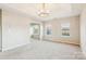 Main bedroom with a tray ceiling, neutral carpet, and lots of natural light at 9146 Austin Ridge Ln, Charlotte, NC 28214