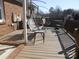 Relaxing outdoor deck with furniture and a porch swing, great for enjoying the weather at 9808 Arbor Dale Ave, Charlotte, NC 28215