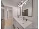 Bright bathroom with double sink vanity and modern fixtures at 0004 Mission Church Rd, Locust, NC 28097