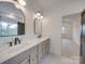 Elegant bathroom showcasing double sinks, granite counters, and modern fixtures at 0004 Mission Church Rd, Locust, NC 28097