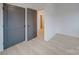 Bedroom featuring light wood floors, white walls, and doors at 0004 Mission Church Rd, Locust, NC 28097