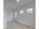 Bright bedroom featuring a ceiling fan and multiple windows at 0004 Mission Church Rd, Locust, NC 28097