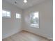 Bright bedroom featuring a ceiling fan and multiple windows at 0004 Mission Church Rd, Locust, NC 28097