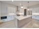 Bright, open kitchen featuring an island, stainless steel appliances, and modern pendant lighting at 0004 Mission Church Rd, Locust, NC 28097