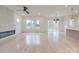 Spacious living room with light hardwood floors, large windows, and a modern fireplace at 0004 Mission Church Rd, Locust, NC 28097