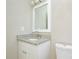 Bathroom featuring a granite vanity, white cabinets, and updated fixtures at 1008 Beaugard Dr, Charlotte, NC 28208