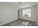 Bright bedroom featuring modern flooring, a neutral color scheme, and a large window for ample natural light at 1008 Beaugard Dr, Charlotte, NC 28208