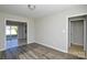 An airy living room featuring modern flooring and access to other rooms, creating a seamless living space at 1008 Beaugard Dr, Charlotte, NC 28208