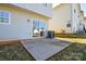 View of the home's patio, sliding glass door, and the exterior siding at 1008 Beaugard Dr, Charlotte, NC 28208