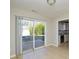 Bright room featuring a sliding glass door to the exterior and seamless transition to the modern kitchen at 1008 Beaugard Dr, Charlotte, NC 28208