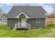 Home exterior with green siding and a small fenced-in back yard at 102 S Liberty St, Gastonia, NC 28052