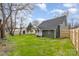 Green backyard featuring a charming home with a well-maintained lawn, creating a serene outdoor space at 102 S Liberty St, Gastonia, NC 28052