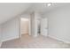 Spacious bedroom featuring an attic design with closet and neutral carpet, perfect for comfortable living at 102 S Liberty St, Gastonia, NC 28052
