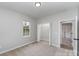 Bedroom features a carpeted floor, a window and access to a closet and other rooms at 102 S Liberty St, Gastonia, NC 28052