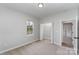 Comfortable bedroom featuring a closet and a window, complemented by neutral carpet, offering simple elegance at 102 S Liberty St, Gastonia, NC 28052
