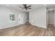 Open-concept living space with hardwood floors, and a staircase at 102 S Liberty St, Gastonia, NC 28052