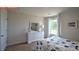 Bedroom featuring carpet flooring, a large window with white curtains, a full bed and a white dresser at 107 Windstone Common Ln, Mooresville, NC 28117