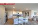 Modern kitchen featuring a granite island, stainless steel appliances, and open layout to the living area at 107 Windstone Common Ln, Mooresville, NC 28117