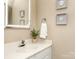 Bright bathroom with a modern LED mirror and clean white sink at 10901 Carmel Crossing Rd, Charlotte, NC 28226