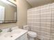 Well-lit bathroom includes a toilet, vanity, and shower with curtain at 10901 Carmel Crossing Rd, Charlotte, NC 28226