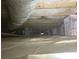 Encapsulated crawlspace showing vapor barrier, support beams, and ductwork for moisture control and stability at 1232 Bilmark Ave, Charlotte, NC 28213