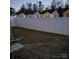 Fenced backyard view features a white fence and potential for outdoor living at 1301 Waylon Ave, Gastonia, NC 28054