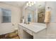 Well-lit bathroom with modern vanity, a framed mirror, and decorative fixtures at 1301 Waylon Ave, Gastonia, NC 28054
